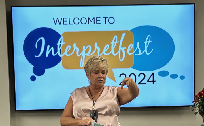 Interpreter Anissa teaching class
